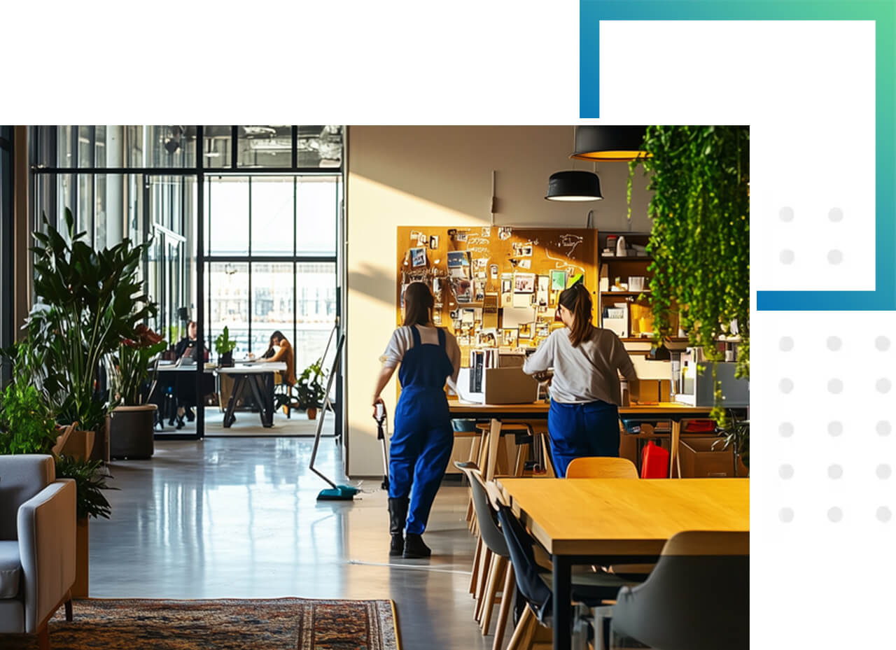 Reinigungsunternehmen für die Büroreinigung Zwei Reinigungskräfte säubern ein modernes, helles Großraumbüro.